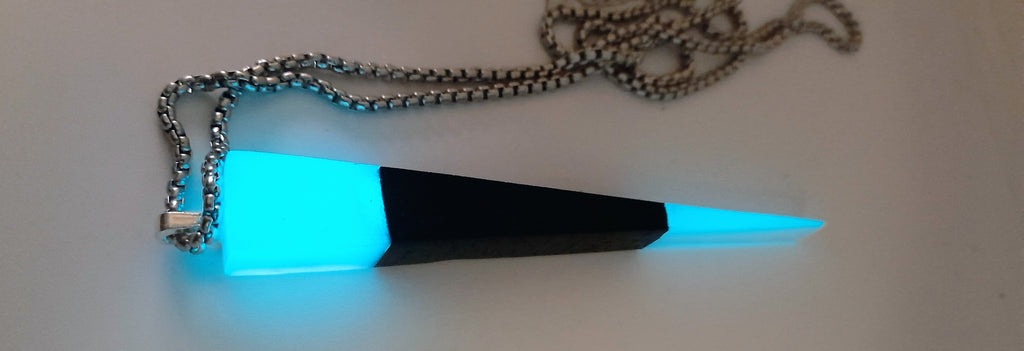 Handmade Irish Bog Oak Dagger Pendant – Glow-in-the-Dark Cyan Resin | Titanium Plated Chain