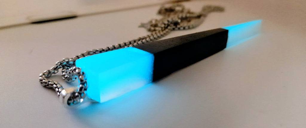 Handmade Irish Bog Oak Dagger Pendant – Glow-in-the-Dark Cyan Resin | Titanium Plated Chain