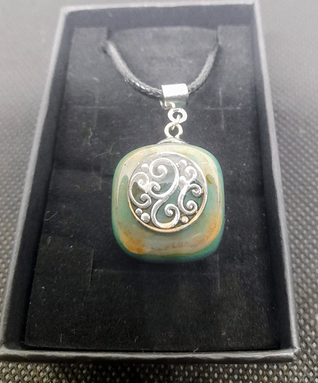 Handmade Irish Green Stone Pendant – Celtic Swirl Design | Black Cord