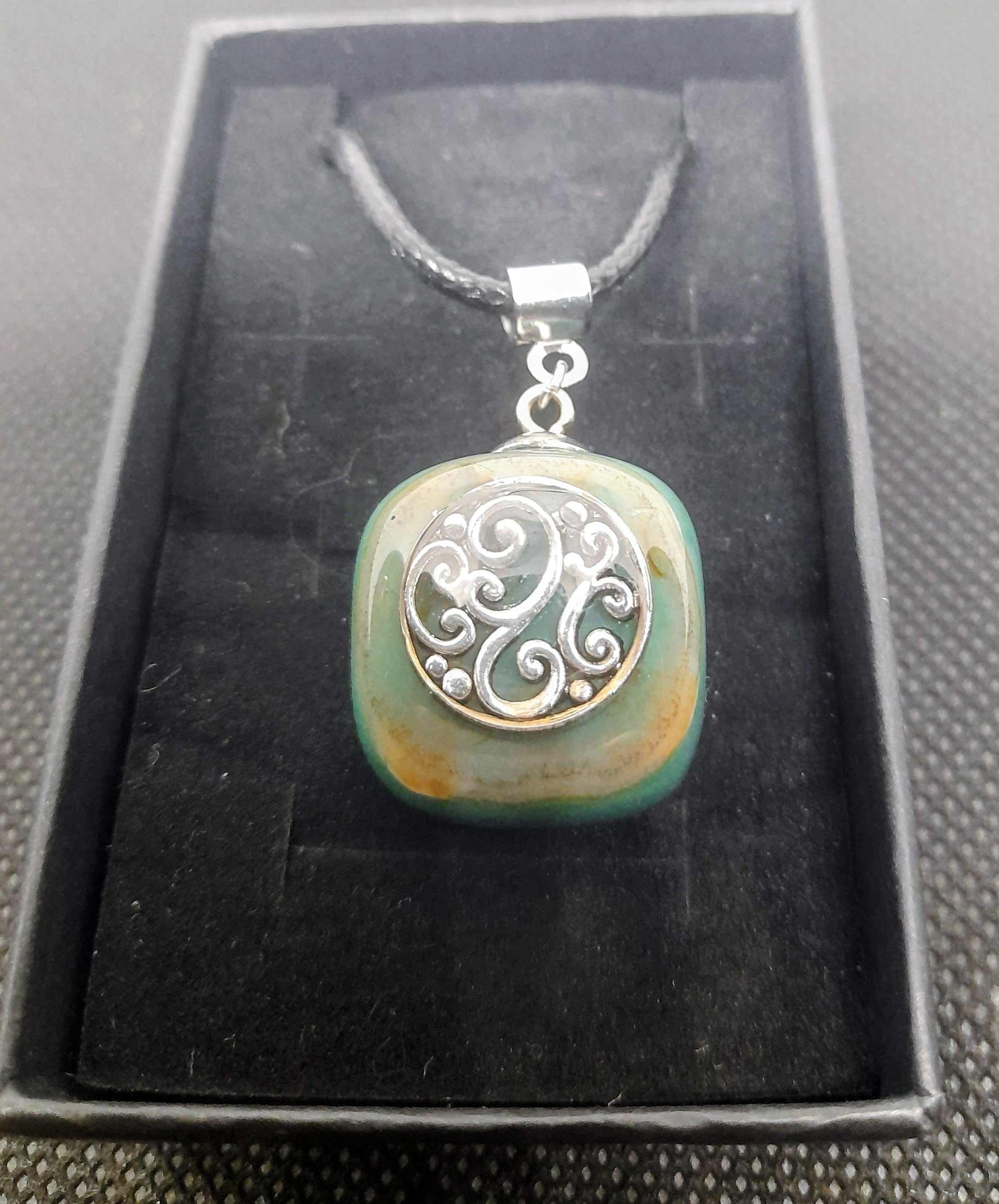 Handmade Irish Green Stone Pendant – Celtic Swirl Design | Black Cord