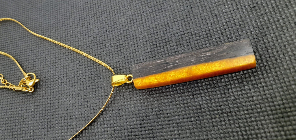 Handmade Irish Bog Oak Bar Pendant – Golden Amber Resin | Gold stainless steel chain