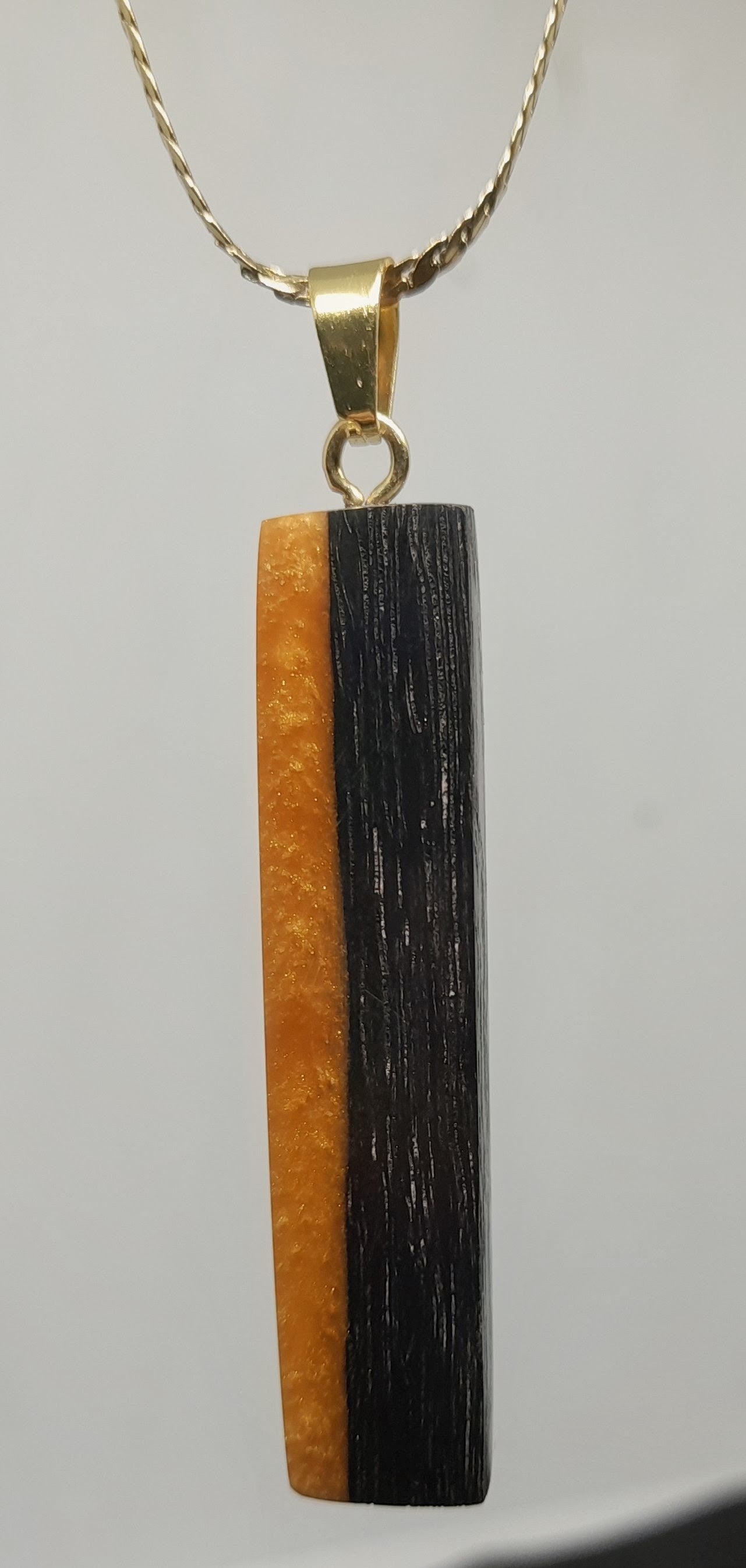 Handmade Irish Bog Oak Bar Pendant – Golden Amber Resin | Gold stainless steel chain